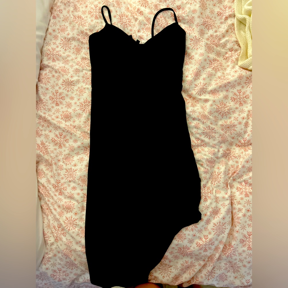 Black HOCO dress. Has a slit down the leg and cross over top.